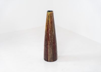 XL “Fat Lava” ceramic floor vase (Germany, 1960s). This impressive multicolored vase features beautiful textures and vibrant colors, finished with a glossy glaze that enhances its unique surface. The vase is in very good condition.