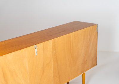 Stunning sideboard with glass doors by CFC Silkeborg (Denmark, 1960s). This elegant mid-century piece, crafted in teak, features beautifully rounded edges, sleek glass sliding doors, and refined wooden handles. Its timeless design combines style with functionality, offering lots of storage space with two adjustable shelves inside. Notably versatile, the sideboard includes three wall mounts on the back, allowing it to be used as a floating sideboard if desired. The legs can be easily removed for this purpose. In very good condition, with only two small repair marks.