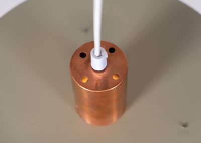 Danish pendant light 1960s. This Danish pendant light from the 1960s features a stunning combination of a copper shade and an olive green lacquered aluminum shade. The copper has a beautiful patina due to its age. The lamp is in very good condition, with a small scuff on the lacquer at the top.