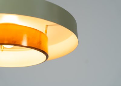 Danish pendant light 1960s. This Danish pendant light from the 1960s features a stunning combination of a copper shade and an olive green lacquered aluminum shade. The copper has a beautiful patina due to its age. The lamp is in very good condition, with a small scuff on the lacquer at the top.