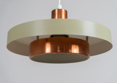 Danish pendant light 1960s. This Danish pendant light from the 1960s features a stunning combination of a copper shade and an olive green lacquered aluminum shade. The copper has a beautiful patina due to its age. The lamp is in very good condition, with a small scuff on the lacquer at the top.