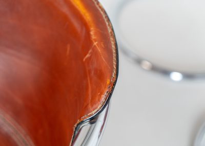 Set of 4 rare leather dining chairs by Willy Rizzo for Metaform (the Netherlands, 1970s). Designed in Italy and manufactured in the Netherlands, these hard to find chairs are a testament to Willy Rizzo’s iconic style. They feature chrome tubular frames and cognac leather seats. The leather showcases a rich patina with visible signs of use, adding character and charm to these remarkable pieces.