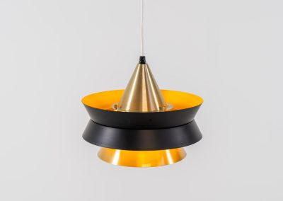 Beautiful messing pendant light by Carl Thore for Granhaga (Sweden, 1960s). This striking mid-century lamp showcases a sophisticated blend of geometric lines and warm metallic tones. Its layered design, combining matte black and brass with a subtle orange interior, creates a stunning interplay of light and shadow. The lamp is rewired and remains in excellent condition.