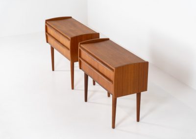 Pair of Mid-century nightstands (Denmark, 1960s). These elegant nightstands are made out of teak and both have two drawers with nice organic handles on them. Both in very good condition with minor using traces.