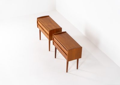 Pair of Mid-century nightstands (Denmark, 1960s). These elegant nightstands are made out of teak and both have two drawers with nice organic handles on them. Both in very good condition with minor using traces.