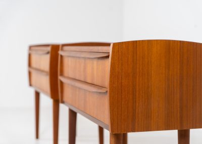 Pair of Mid-century nightstands (Denmark, 1960s). These elegant nightstands are made out of teak and both have two drawers with nice organic handles on them. Both in very good condition with minor using traces.