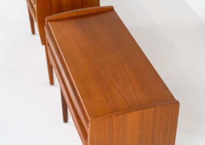 Pair of Mid-century nightstands (Denmark, 1960s). These elegant nightstands are made out of teak and both have two drawers with nice organic handles on them. Both in very good condition with minor using traces.
