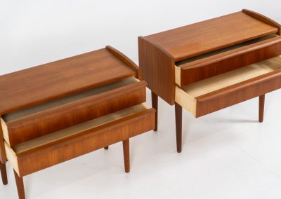 Pair of Mid-century nightstands (Denmark, 1960s). These elegant nightstands are made out of teak and both have two drawers with nice organic handles on them. Both in very good condition with minor using traces.