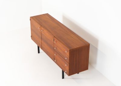 Modernist “1864” sideboard by Pierre Guariche for Meurop (Belgium, 1950s). A beautiful example of Belgian modernism! It features a warm meranti woodgrain, a sleek black lacquered metal frame and aluminium handles. It remains in very good vintage condition with some minor restoration Marks, shown on the pictures.