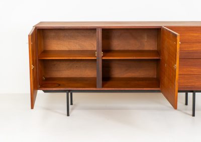 Modernist “1864” sideboard by Pierre Guariche for Meurop (Belgium, 1950s). A beautiful example of Belgian modernism! It features a warm meranti woodgrain, a sleek black lacquered metal frame and aluminium handles. It remains in very good vintage condition with some minor restoration Marks, shown on the pictures.