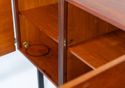 Modernist “1864” sideboard by Pierre Guariche for Meurop (Belgium, 1950s). A beautiful example of Belgian modernism! It features a warm meranti woodgrain, a sleek black lacquered metal frame and aluminium handles. It remains in very good vintage condition with some minor restoration Marks, shown on the pictures.