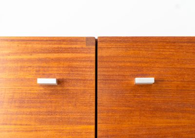 Modernist “1864” sideboard by Pierre Guariche for Meurop (Belgium, 1950s). A beautiful example of Belgian modernism! It features a warm meranti woodgrain, a sleek black lacquered metal frame and aluminium handles. It remains in very good vintage condition with some minor restoration Marks, shown on the pictures.