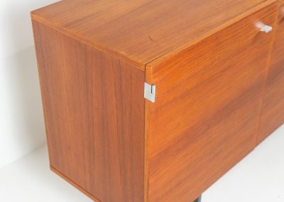 Modernist “1864” sideboard by Pierre Guariche for Meurop (Belgium, 1950s). A beautiful example of Belgian modernism! It features a warm meranti woodgrain, a sleek black lacquered metal frame and aluminium handles. It remains in very good vintage condition with some minor restoration Marks, shown on the pictures.