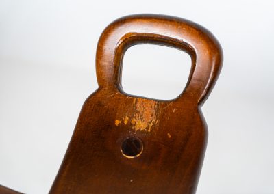 Set of 3 Brutalist “Marbella” stools manufactured by Conoform and attributed to Sergio Rodrigues (Spain, 1970s). This iconic set of Marbella stools, also known as the “Spanish Stool,” exemplifies brutalist design with a sculptural flair. Crafted from solid beech wood, the stools feature a distinctive curved seat and are complemented by a sturdy iron footrest. The set is in good vintage condition, displaying some signs of use such as seat marks and wear consistent with age.