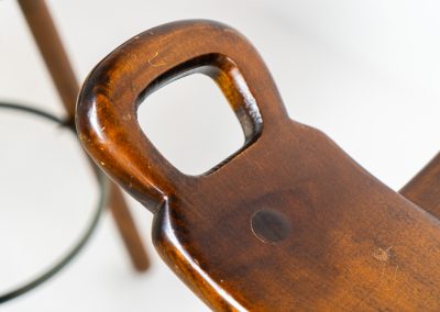 Set of 3 Brutalist “Marbella” stools manufactured by Conoform and attributed to Sergio Rodrigues (Spain, 1970s). This iconic set of Marbella stools, also known as the “Spanish Stool,” exemplifies brutalist design with a sculptural flair. Crafted from solid beech wood, the stools feature a distinctive curved seat and are complemented by a sturdy iron footrest. The set is in good vintage condition, displaying some signs of use such as seat marks and wear consistent with age.