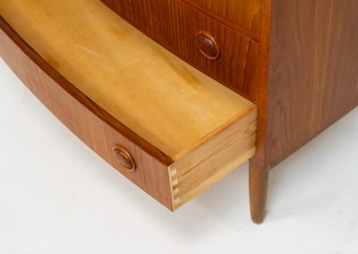 Bow front chest of drawers Kai Kristiansen (Denmark, 1960s). A very convenient and elegant piece with six drawers and nice organic sculpted handles, crafted out of teak. In good vintage condition with some visible using traces, mainly on the top. Original key included.