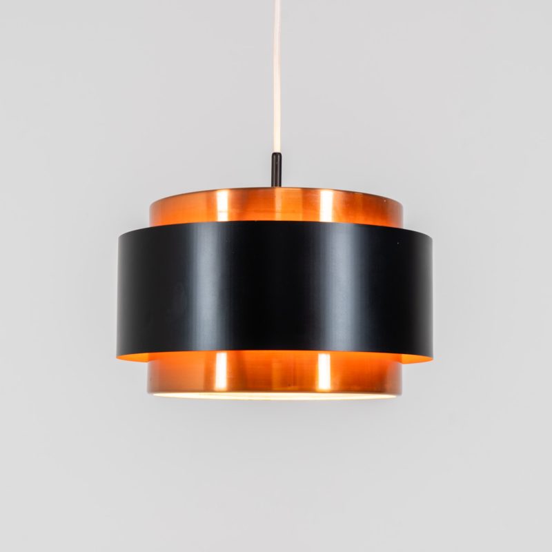 Stunning Saturn pendant light by Jo Hammerborg for Fog & Mørup (Denmark, 1960s). A stunning design with a beatutiful contrast between copper and matte black. At the top and the bottom, the lamp is closed by two acrylic plates that create an anti-dazzle and glare-free effect. A high end piece, made with quality materials. In very good condition! It features the original Fog & Mørup lable inside.