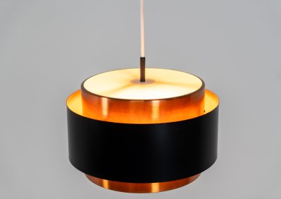 Stunning Saturn pendant light by Jo Hammerborg for Fog & Mørup (Denmark, 1960s). A stunning design with a beatutiful contrast between copper and matte black. At the top and the bottom, the lamp is closed by two acrylic plates that create an anti-dazzle and glare-free effect. A high end piece, made with quality materials. In very good condition! It features the original Fog & Mørup lable inside.