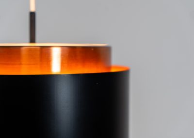 Stunning Saturn pendant light by Jo Hammerborg for Fog & Mørup (Denmark, 1960s). A stunning design with a beatutiful contrast between copper and matte black. At the top and the bottom, the lamp is closed by two acrylic plates that create an anti-dazzle and glare-free effect. A high end piece, made with quality materials. In very good condition! It features the original Fog & Mørup lable inside.