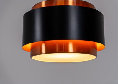 Stunning Saturn pendant light by Jo Hammerborg for Fog & Mørup (Denmark, 1960s). A stunning design with a beatutiful contrast between copper and matte black. At the top and the bottom, the lamp is closed by two acrylic plates that create an anti-dazzle and glare-free effect. A high end piece, made with quality materials. In very good condition! It features the original Fog & Mørup lable inside.