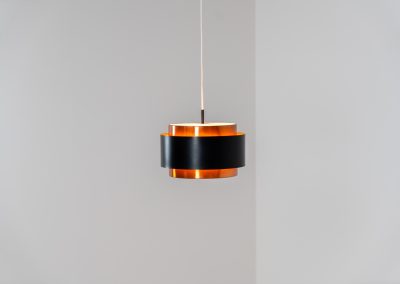 Stunning Saturn pendant light by Jo Hammerborg for Fog & Mørup (Denmark, 1960s). A stunning design with a beatutiful contrast between copper and matte black. At the top and the bottom, the lamp is closed by two acrylic plates that create an anti-dazzle and glare-free effect. A high end piece, made with quality materials. In very good condition! It features the original Fog & Mørup lable inside.