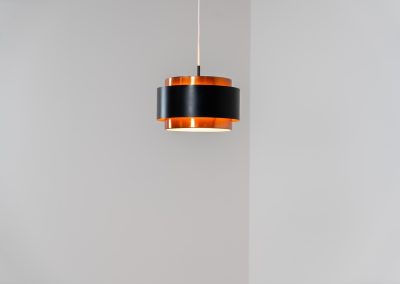Stunning Saturn pendant light by Jo Hammerborg for Fog & Mørup (Denmark, 1960s). A stunning design with a beatutiful contrast between copper and matte black. At the top and the bottom, the lamp is closed by two acrylic plates that create an anti-dazzle and glare-free effect. A high end piece, made with quality materials. In very good condition! It features the original Fog & Mørup lable inside.