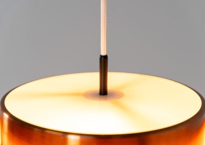 Stunning Saturn pendant light by Jo Hammerborg for Fog & Mørup (Denmark, 1960s). A stunning design with a beatutiful contrast between copper and matte black. At the top and the bottom, the lamp is closed by two acrylic plates that create an anti-dazzle and glare-free effect. A high end piece, made with quality materials. In very good condition! It features the original Fog & Mørup lable inside.