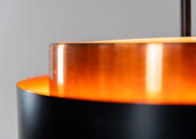 Stunning Saturn pendant light by Jo Hammerborg for Fog & Mørup (Denmark, 1960s). A stunning design with a beatutiful contrast between copper and matte black. At the top and the bottom, the lamp is closed by two acrylic plates that create an anti-dazzle and glare-free effect. A high end piece, made with quality materials. In very good condition! It features the original Fog & Mørup lable inside.