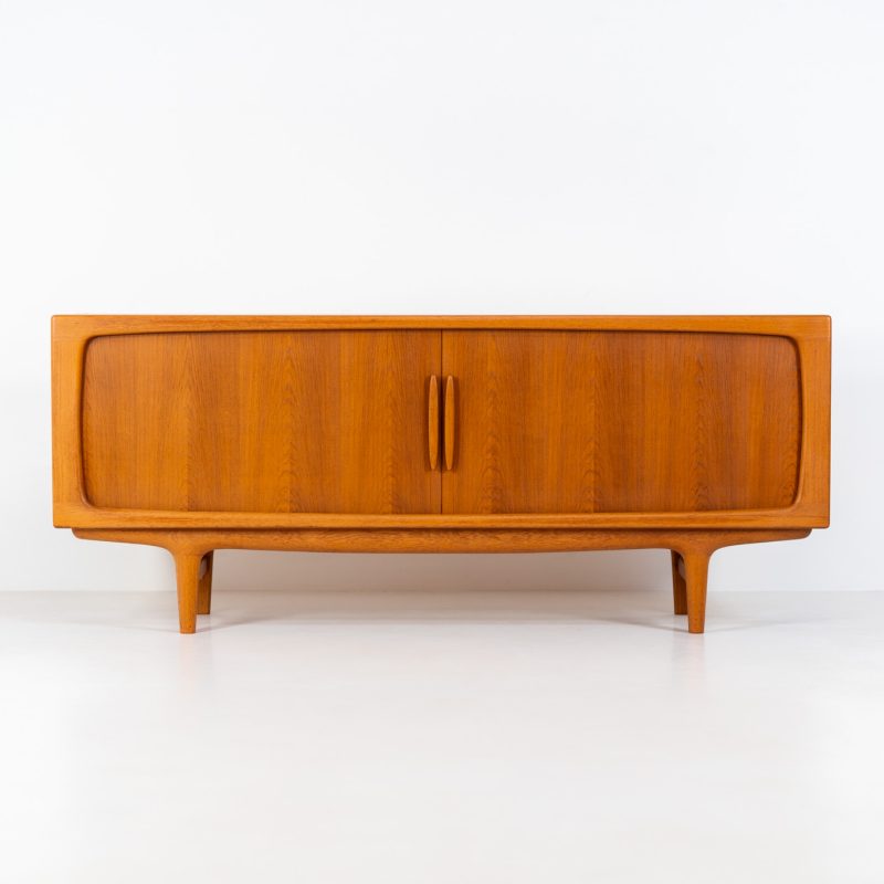 Exceptional sideboard by Johannes Andersen for CFC Silkeborg (Denmark, 1960s). Just wow.. what a piece! Clearly an example of top-notch Danish craftmanship, designed by one of Denemarks most beloved designers, Johannes Andersen. The sideboard is made out of teak and features stunning organic shapes and lots of amazing details, like the two big tambour doors and the rounded handles. This piece presents itself in mint condition with no damages or significant using traces.