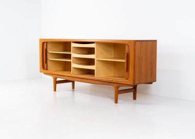 Exceptional sideboard by Johannes Andersen for CFC Silkeborg (Denmark, 1960s). Just wow.. what a piece! Clearly an example of top-notch Danish craftmanship, designed by one of Denemarks most beloved designers, Johannes Andersen. The sideboard is made out of teak and features stunning organic shapes and lots of amazing details, like the two big tambour doors and the rounded handles. This piece presents itself in mint condition with no damages or significant using traces.