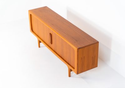 Exceptional sideboard by Johannes Andersen for CFC Silkeborg (Denmark, 1960s). Just wow.. what a piece! Clearly an example of top-notch Danish craftmanship, designed by one of Denemarks most beloved designers, Johannes Andersen. The sideboard is made out of teak and features stunning organic shapes and lots of amazing details, like the two big tambour doors and the rounded handles. This piece presents itself in mint condition with no damages or significant using traces.
