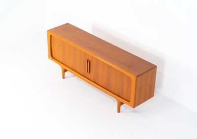 Exceptional sideboard by Johannes Andersen for CFC Silkeborg (Denmark, 1960s). Just wow.. what a piece! Clearly an example of top-notch Danish craftmanship, designed by one of Denemarks most beloved designers, Johannes Andersen. The sideboard is made out of teak and features stunning organic shapes and lots of amazing details, like the two big tambour doors and the rounded handles. This piece presents itself in mint condition with no damages or significant using traces.