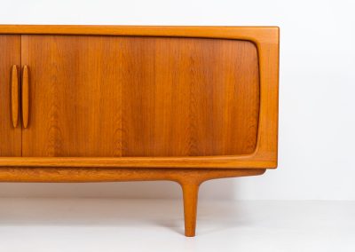 Exceptional sideboard by Johannes Andersen for CFC Silkeborg (Denmark, 1960s). Just wow.. what a piece! Clearly an example of top-notch Danish craftmanship, designed by one of Denemarks most beloved designers, Johannes Andersen. The sideboard is made out of teak and features stunning organic shapes and lots of amazing details, like the two big tambour doors and the rounded handles. This piece presents itself in mint condition with no damages or significant using traces.