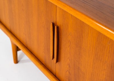 Exceptional sideboard by Johannes Andersen for CFC Silkeborg (Denmark, 1960s). Just wow.. what a piece! Clearly an example of top-notch Danish craftmanship, designed by one of Denemarks most beloved designers, Johannes Andersen. The sideboard is made out of teak and features stunning organic shapes and lots of amazing details, like the two big tambour doors and the rounded handles. This piece presents itself in mint condition with no damages or significant using traces.
