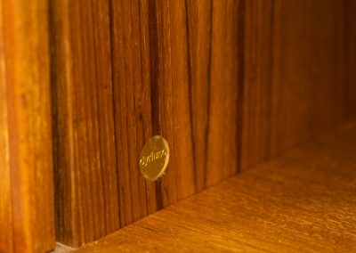Beautiful bookcase in teak by Svend Dyrlund with tambour doors (Denmark, 1960s). This bookcase perfectly combines organic shapes and loads of detail, like the tambour sliding doors, the beautiful handles or the bulky shelves, which are adjustable in height. It offers lots of storage space! In mint condition!