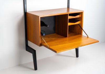 Extremely rare standing wall-unit with bar by Poul Cadovius (Denmark, 1960s). A true masterpiece of Danish modernism and a model we have never seen before! It features two metal Z-shaped wall supports, three normal shelves, one slightly wider shelve and a bar cabinet with amazing details like the bentwood shelves on the inside, the woven teak door or the build-in bottle rack. This extraordinary piece presents itself in mint condition!