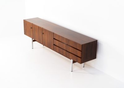Exceptional XL sideboard in rosewood by Musterring (Germany, 1960s). A stunning modernist piece with a minimalist design, emphasizing clean lines and rich rosewood tones paired with metal legs. It features six sleek drawers and three doors with lots of storage space on the inside. The sideboard is in amazing condition.