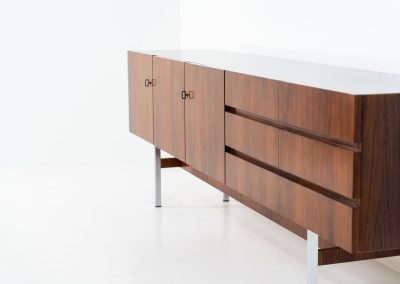 Exceptional XL sideboard in rosewood by Musterring (Germany, 1960s). A stunning modernist piece with a minimalist design, emphasizing clean lines and rich rosewood tones paired with metal legs. It features six sleek drawers and three doors with lots of storage space on the inside. The sideboard is in amazing condition.