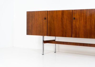 Exceptional XL sideboard in rosewood by Musterring (Germany, 1960s). A stunning modernist piece with a minimalist design, emphasizing clean lines and rich rosewood tones paired with metal legs. It features six sleek drawers and three doors with lots of storage space on the inside. The sideboard is in amazing condition.