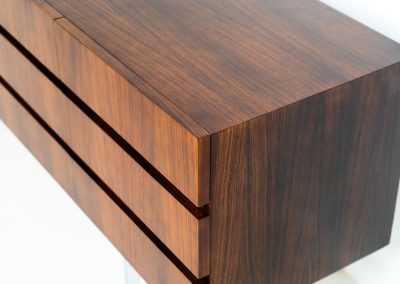 Exceptional XL sideboard in rosewood by Musterring (Germany, 1960s). A stunning modernist piece with a minimalist design, emphasizing clean lines and rich rosewood tones paired with metal legs. It features six sleek drawers and three doors with lots of storage space on the inside. The sideboard is in amazing condition.