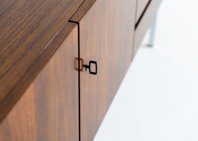 Exceptional XL sideboard in rosewood by Musterring (Germany, 1960s). A stunning modernist piece with a minimalist design, emphasizing clean lines and rich rosewood tones paired with metal legs. It features six sleek drawers and three doors with lots of storage space on the inside. The sideboard is in amazing condition.