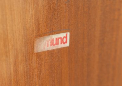 Stunning showcase by Svend Dyrlund (Denmark, 1960s). This exceptional piece features elegant glass doors with beautifully crafted wooden handles, two adjustable shelves, and convenient backlights behind each shelf to highlight your displayed items. Made from rich teak with a natural woodgrain, it perfectly combines functionality with the timeless characteristic of Danish modern design. In splendid condition.