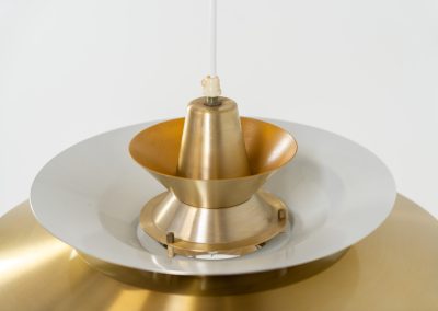 Elegant pendant light by Knud Christensen (Denmark, 1970s). A very nice lamp made of five aluminium shades in a messing color, with yellow details on the inside. It is Nelly rewired and in very good condition!