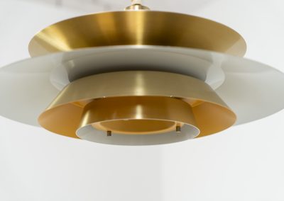 Elegant pendant light by Knud Christensen (Denmark, 1970s). A very nice lamp made of five aluminium shades in a messing color, with yellow details on the inside. It is Nelly rewired and in very good condition!
