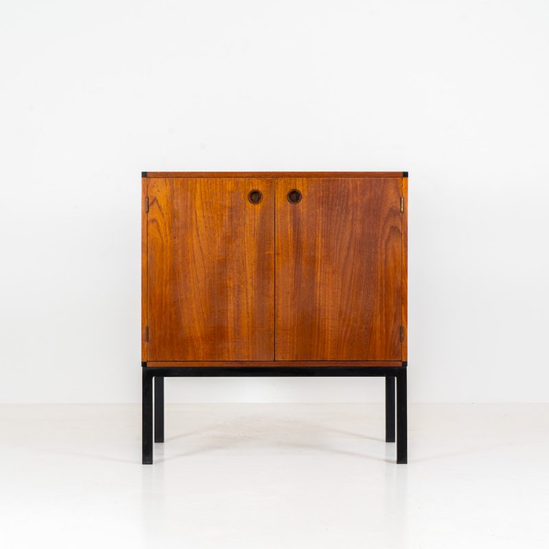 Compact cabinet by Hans Hove & Palle Petersen (Denmark, 1960s). A compact and highly sought after modernist piece by the great Hans Hove & Palle Petersen, produced by Christian Linnebergs møbelfabrik. Its crafted out of teak and stands on a black steel frame. Its in very good vintage condition, with some signs of wear consistent with the age.