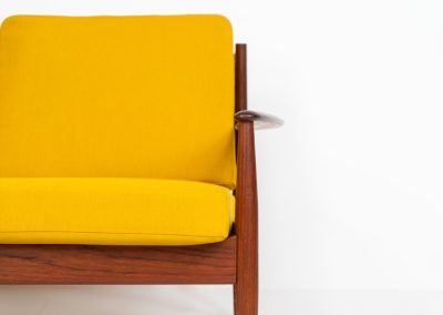 “FD-128” 3-seater by Grete Jalk for France & Son (Denmark, 1960s). This elegant masterpiece is a fine example of Scandinavian modernism. It features a solid teak frame with a warm natural grain, stunning curves and comfortable cushions, upholstered in a yellow fabric. The sofa presents itself in very good condition with only minor wear on the fabric. Labeled by maker.