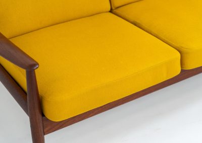 “FD-128” 3-seater by Grete Jalk for France & Son (Denmark, 1960s). This elegant masterpiece is a fine example of Scandinavian modernism. It features a solid teak frame with a warm natural grain, stunning curves and comfortable cushions, upholstered in a yellow fabric. The sofa presents itself in very good condition with only minor wear on the fabric. Labeled by maker.