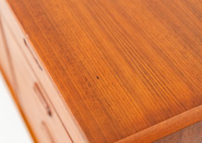 Stunning XL sideboard in teak by Bartels Werken (Germany, 1960s). A beautiful sleek sideboard featuring three doors and four drawers with beautiful inset handles. It has a warm and natural woodgrain which gives this rather minimalistic piece an elegant appearance. Its in amazing condition!