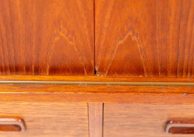 Teak highboard by P. Westergaard (Denmark, 1960s). This beautiful highboard comes with four sliding Doors and two wide drawers. It has beautiful teak wood patterns, nice inset handels and tons of storage space on the inside. Its in very good vintage condition with a few repair marks and small age related using traces. Labeled by maker.