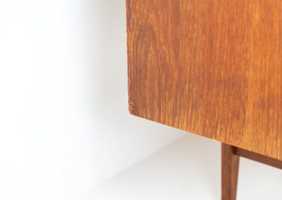 Teak highboard by P. Westergaard (Denmark, 1960s). This beautiful highboard comes with four sliding Doors and two wide drawers. It has beautiful teak wood patterns, nice inset handels and tons of storage space on the inside. Its in very good vintage condition with a few repair marks and small age related using traces. Labeled by maker.